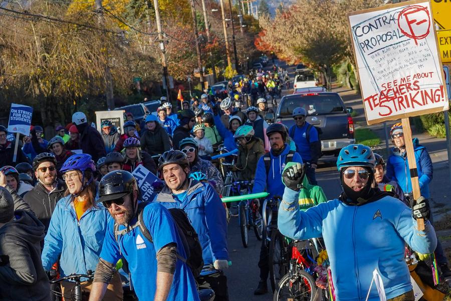 PAT members wearing blue riding bikes