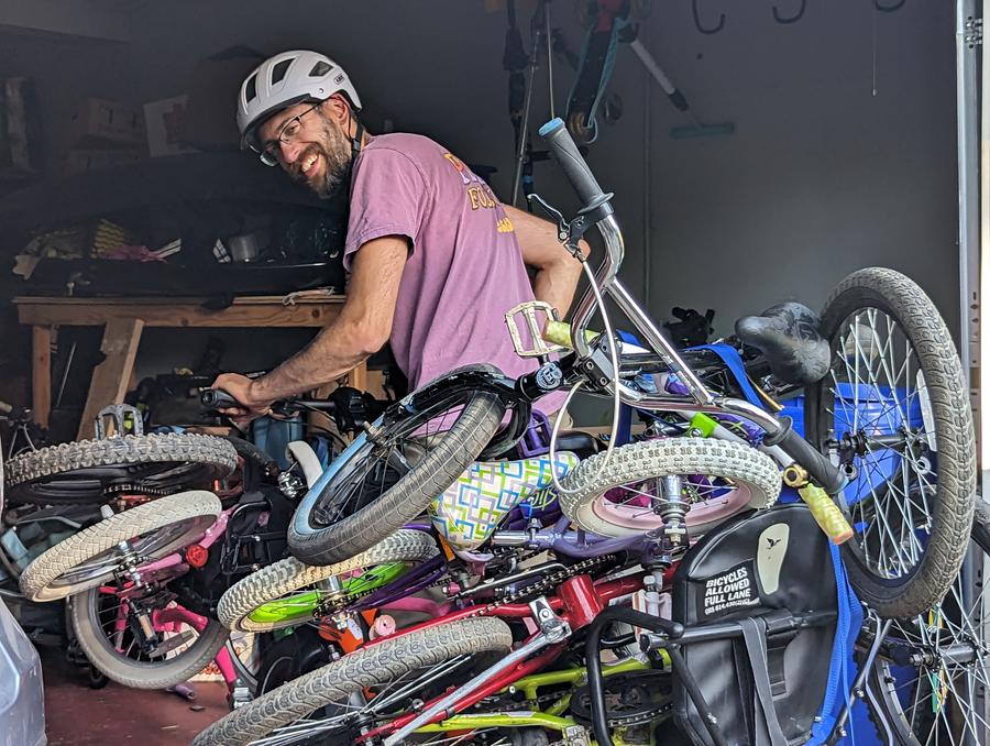 many bikes on the back of a cargo bike