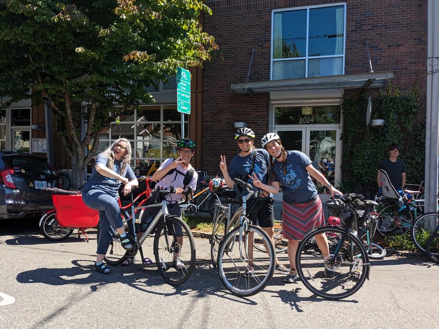4 teachers posing on their bikes being goofy